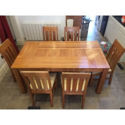 Large Oak dining table & six genuine leather cushioned chairs