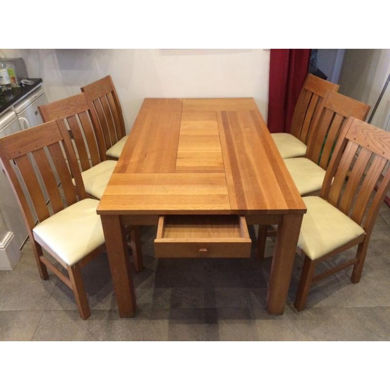 Large Oak dining table & six genuine leather cushioned chairs