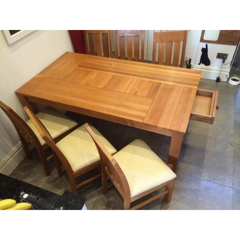 Large Oak dining table & six genuine leather cushioned chairs