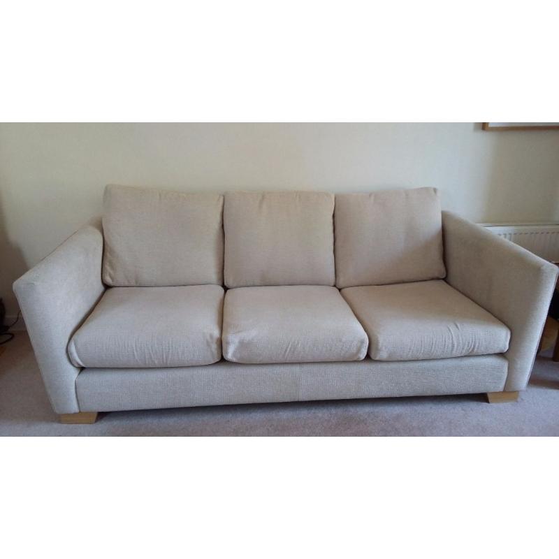 Large beige sofa with matching chair