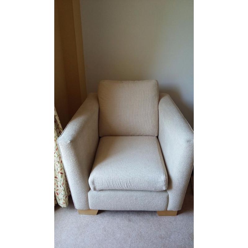 Large beige sofa with matching chair