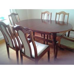 dining table extendable and 6 chairs selling because moving