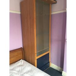 Tall wardrobe with draws