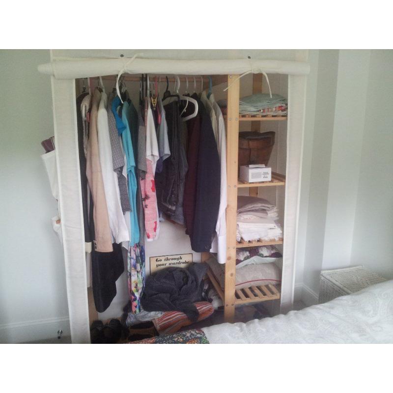 Pine slatted wardrobe from Ikea, with canvas cover. includes rail and shelving