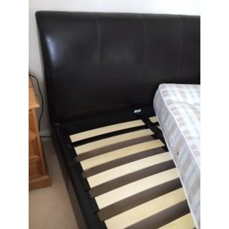 Small 4ft double bed. Excellent condition. Smart faux dark brown leather padded headboard.