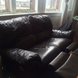 Double reclining brown leather sofa