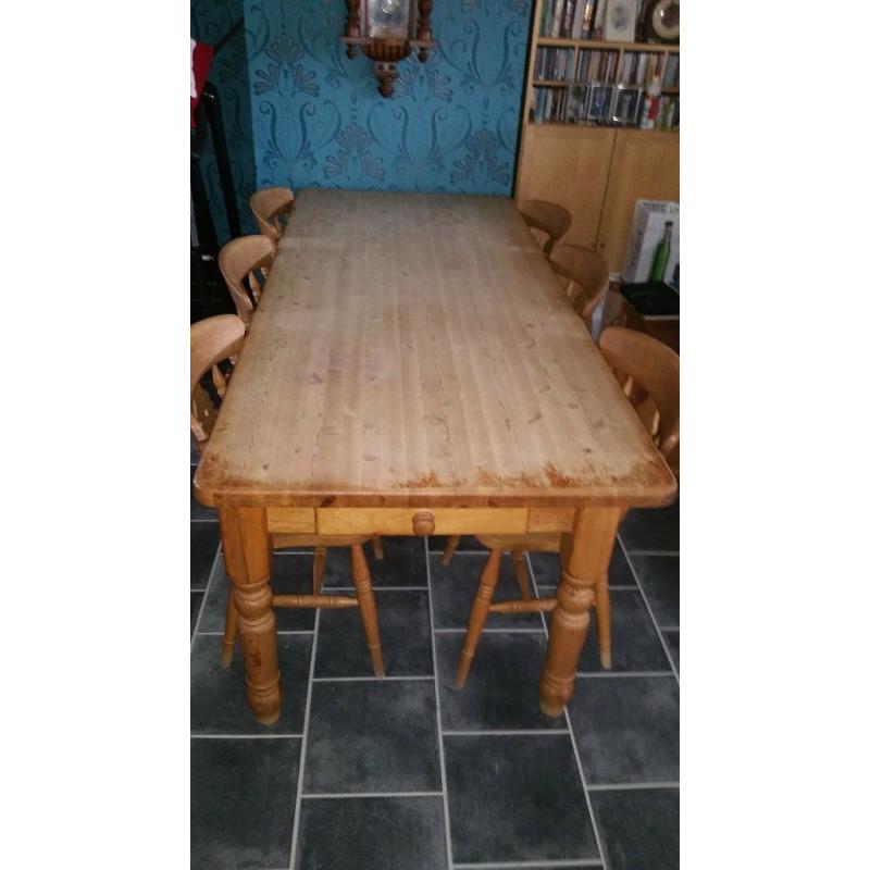 traditional pine farmhouse table and 6 chairs.