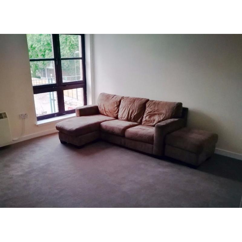 Brown 3 seater L shaped sofa and foot stool