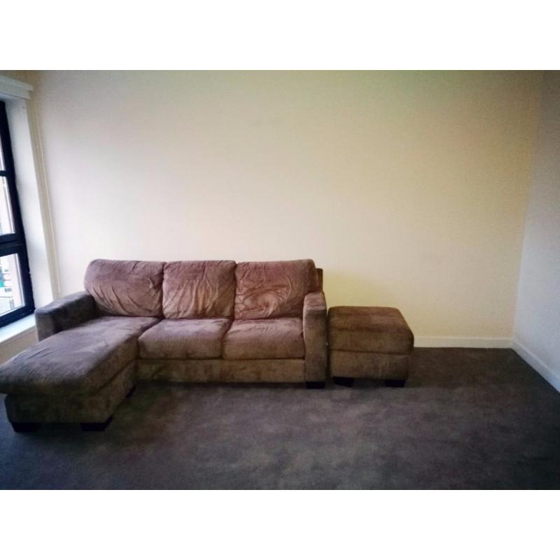 Brown 3 seater L shaped sofa and foot stool