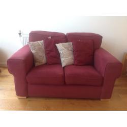 Small two seater burgundy sofa