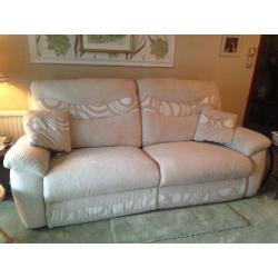 Cream sofa with pop up foot rests!