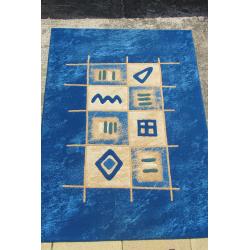 LARGE BLUE RUG. 91" IN LENGTH AND 68" WIDE.