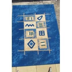 LARGE BLUE RUG. 91" IN LENGTH AND 68" WIDE.