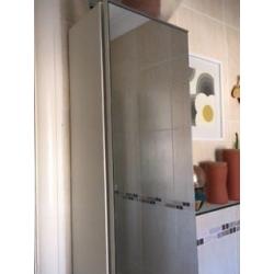 Tall, mirrored bathroom cabinet