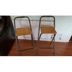 Two folding high stools